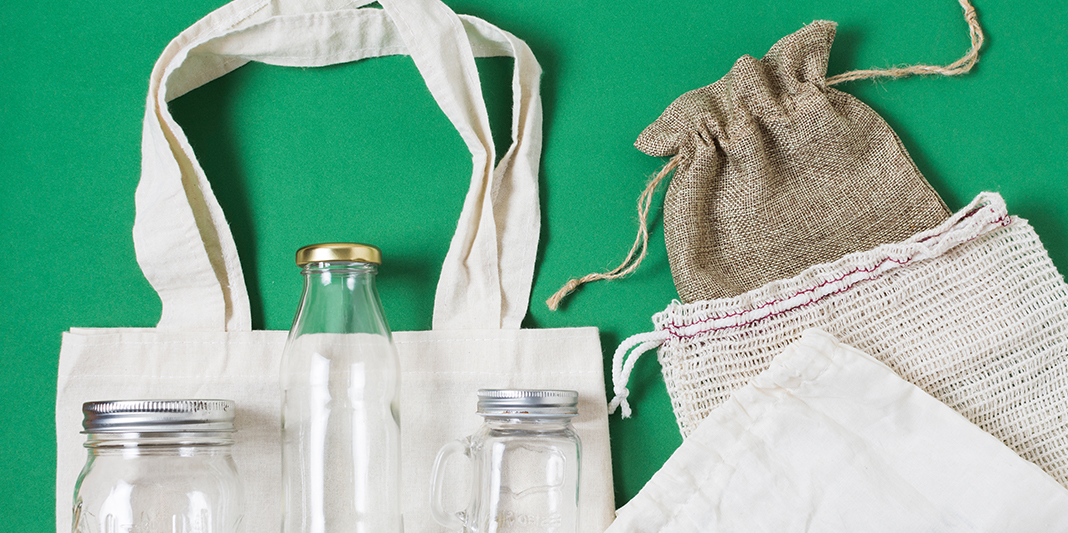 flat-lay-different-zero-waste-products-green-background