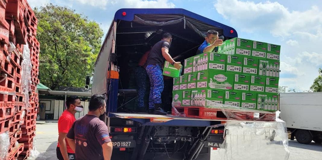 Spritzer Distributes Bottled Water To Communities Affected By Floods