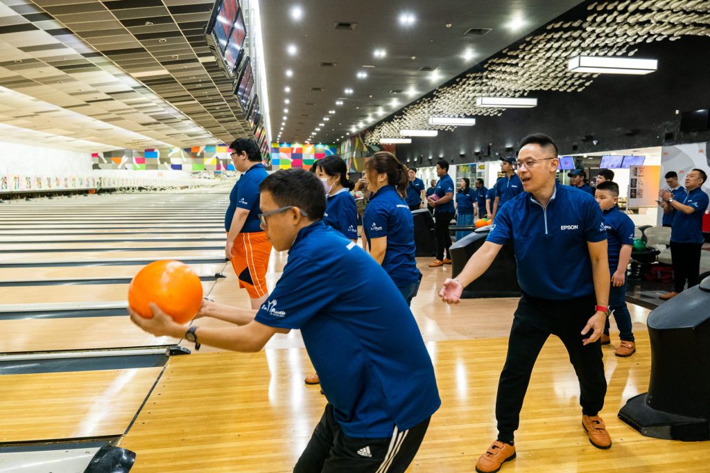 Members of Epson and United enjoying a game of bowling together during the CSR event