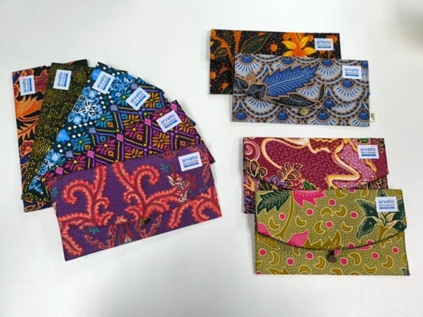 Batik-themed pouches commissioned by Arvato Systems Malaysia in support of the B40 community.